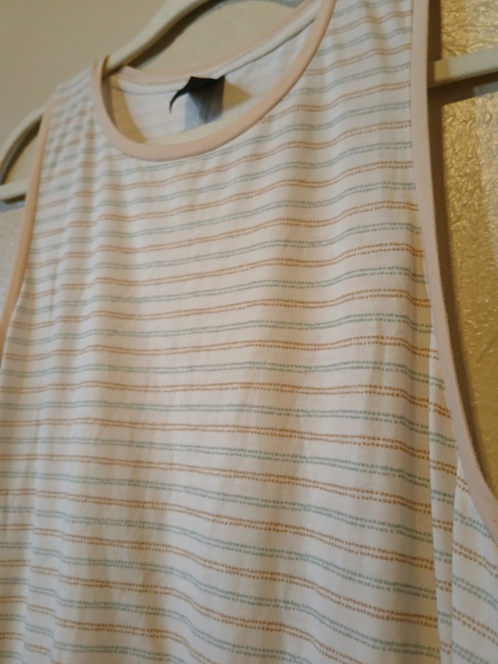 Cream Sleeveless Tank with Subtle Pastel Stripes